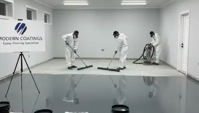 Epoxy garage floor coating in Plymouth MA by professional house painters for durable, glossy finish