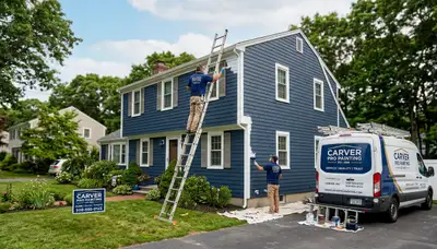 Professional house painters working on residential exterior in Plymouth, MA